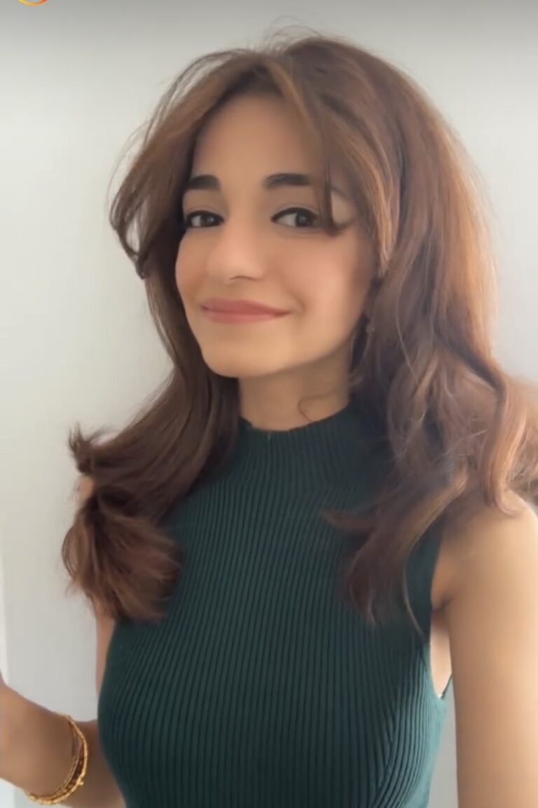 Mishal in a green dress